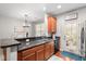 Well-appointed kitchen with wood cabinets, stainless steel appliances, and modern lighting at 2505 Stadium Dr, North Charleston, SC 29406