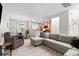 Open-concept living area with a sectional sofa, accent chair, and dining area at 2505 Stadium Dr, North Charleston, SC 29406