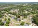 A high resolution aerial view of the property in a lush neighborhood, featuring a pool at 2506 Birkenhead Dr, Charleston, SC 29414