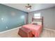 Cozy bedroom with gray walls, a vintage headboard and a decorative wood trunk at the foot of the bed at 2506 Birkenhead Dr, Charleston, SC 29414