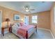 Cozy bedroom featuring a patterned bedspread, ceiling fan, and bright natural light at 2506 Birkenhead Dr, Charleston, SC 29414