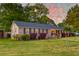 Charming brick home with manicured lawn and shrubbery, creating a welcoming curb appeal at 2506 Birkenhead Dr, Charleston, SC 29414