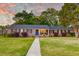 Beautiful brick home with a well-maintained lawn and a inviting walkway at 2506 Birkenhead Dr, Charleston, SC 29414
