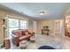Cozy living room with a leather sofa, neutral walls, and bright natural light at 2506 Birkenhead Dr, Charleston, SC 29414
