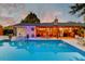 Inviting backyard pool and patio with outdoor seating, perfect for entertaining under the string lights at 2506 Birkenhead Dr, Charleston, SC 29414
