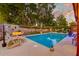 Inviting backyard pool with chairs and loungers, perfect for relaxation and outdoor entertainment at 2506 Birkenhead Dr, Charleston, SC 29414
