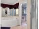 Bathroom featuring soaking tub and closet at 260 Lake Dr, Summerville, SC 29483