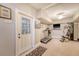 Finished basement with home gym, walk-out access, tile flooring and recessed lighting at 2640 Crooked Stick Ln, Mount Pleasant, SC 29466