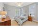 Cozy bedroom with light blue walls, carpeted floors, and balcony access at 2640 Crooked Stick Ln, Mount Pleasant, SC 29466
