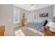 Comfortable bedroom with natural light, complemented by light gray walls and a ceiling fan at 2640 Crooked Stick Ln, Mount Pleasant, SC 29466