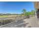 Large deck with golf course views and outdoor seating at 2640 Crooked Stick Ln, Mount Pleasant, SC 29466
