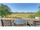 Deck overlooking a golf course with a table and chairs at 2640 Crooked Stick Ln, Mount Pleasant, SC 29466