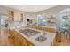 Spacious kitchen featuring a large island cooktop with quartz countertops and stainless steel sink at 2640 Crooked Stick Ln, Mount Pleasant, SC 29466