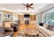 Cozy living room with built-in shelving, a fireplace, and hardwood floors at 2640 Crooked Stick Ln, Mount Pleasant, SC 29466