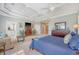 Comfortable main bedroom featuring tray ceilings, carpet floors, and an ensuite bathroom at 2640 Crooked Stick Ln, Mount Pleasant, SC 29466