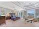 Stylish main bedroom with coffered ceilings, balcony access, and a sitting area at 2640 Crooked Stick Ln, Mount Pleasant, SC 29466