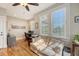 Bright home office with hardwood floors, neutral walls, and comfortable seating area at 2640 Crooked Stick Ln, Mount Pleasant, SC 29466