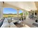 Inviting porch with comfortable seating, potted plants, and picturesque golf course views at 2640 Crooked Stick Ln, Mount Pleasant, SC 29466