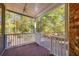 Cozy back porch with wood flooring, perfect for relaxing and enjoying the peaceful ambiance of the backyard at 2800 Waterpointe Cir, Mount Pleasant, SC 29466
