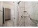 Bathroom featuring a modern glass-enclosed shower with marble-like tiling and built-in shelving at 2800 Waterpointe Cir, Mount Pleasant, SC 29466