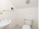 Half bathroom featuring a pedestal sink and toilet against a light wall at 2800 Waterpointe Cir, Mount Pleasant, SC 29466
