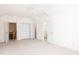 Neutral bedroom includes a double door closet, an open door to the basement, and an open door to the bathroom at 2800 Waterpointe Cir, Mount Pleasant, SC 29466