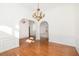 View of dining room with hardwood floors, chandelier, and a clear sightline into other rooms at 2800 Waterpointe Cir, Mount Pleasant, SC 29466