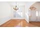 View of dining room with hardwood floors, chandelier, and a clear sightline into other rooms at 2800 Waterpointe Cir, Mount Pleasant, SC 29466