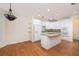 Spacious kitchen featuring an island, hardwood floors, and modern appliances at 2800 Waterpointe Cir, Mount Pleasant, SC 29466