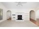 Bright living room with fireplace, archways and neutral carpet at 2800 Waterpointe Cir, Mount Pleasant, SC 29466