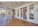Relaxing screened porch with wood floors, ceiling fan, and entry to the home, perfect for enjoying the outdoors at 2800 Waterpointe Cir, Mount Pleasant, SC 29466