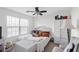 Cozy bedroom has a white wicker wardrobe, chair, and accent pieces at 2911 Penobscot Dr, North Charleston, SC 29420
