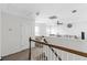 Hallway leads to a cozy living area with natural light and plush seating at 2911 Penobscot Dr, North Charleston, SC 29420