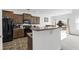 Cozy kitchen featuring wood cabinetry, granite countertops, and a breakfast bar with an adjacent dining area at 2911 Penobscot Dr, North Charleston, SC 29420