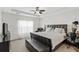 Serene main bedroom offers a tray ceiling, neutral tones, and ample natural light for a relaxing retreat at 2911 Penobscot Dr, North Charleston, SC 29420