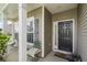 Inviting front porch features stylish decor and seating, leading to the front door at 2911 Penobscot Dr, North Charleston, SC 29420