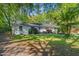 Inviting single-story home with lush green lawn and established trees at 2988 Bolton Rd, Charleston, SC 29414