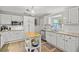 Bright kitchen with white cabinets, stainless steel appliances, and an eat-in breakfast island at 2988 Bolton Rd, Charleston, SC 29414