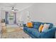 Comfortable living room featuring a stylish blue sofa with yellow accent pillows at 2988 Bolton Rd, Charleston, SC 29414