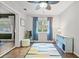 Bright home office space featuring natural light, a playful rug, and practical furnishings at 2988 Bolton Rd, Charleston, SC 29414