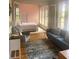 Bright and airy bedroom with double doors to the living area, bathed in natural light from stained glass windows at 309 Meeting St # 8, Charleston, SC 29401