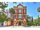 Unique brick building with ornate architectural details and arched windows, set in a vibrant neighborhood at 309 Meeting St # 8, Charleston, SC 29401