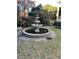 Three tier water fountain situated on lawn with mature greenery at 309 Meeting St # 8, Charleston, SC 29401
