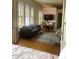 Inviting living room showcases stained glass windows, a comfortable sofa, and views of the bedroom at 309 Meeting St # 8, Charleston, SC 29401