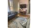 Comfortable living space with a plush sofa, accent chair, and a dining area set against stained glass windows at 309 Meeting St # 8, Charleston, SC 29401