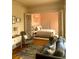 Cozy living room featuring hardwood floors, neutral furniture, and open access to the adjacent bedroom at 309 Meeting St # 8, Charleston, SC 29401