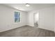 This well-lit bedroom features wood floors and an ensuite bathroom with a white toilet at 3364 Osceola St, North Charleston, SC 29405