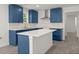 Bright kitchen featuring a kitchen island and blue cabinets and new appliances at 3364 Osceola St, North Charleston, SC 29405