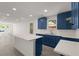 Modern kitchen with blue cabinets, white countertop island, and open-concept design at 3364 Osceola St, North Charleston, SC 29405
