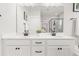 Bright bathroom features a double vanity with marble counters, black fixtures, and tiled shower at 361 Ripple Park Dr, Summerville, SC 29486